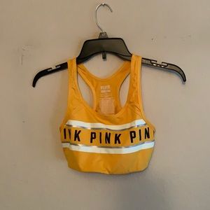 A yellow/gold sports bra from PINK Victoria’s Secret